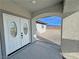 Inviting front entrance featuring elegant double doors and an arched entryway at 1131 Lupin St, Pahrump, NV 89048