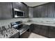 Updated kitchen featuring stainless steel appliances and marbled countertops at 1131 Lupin St, Pahrump, NV 89048