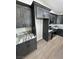 Well-designed kitchen with dark wood cabinetry, stainless steel appliances and marbled countertops at 1131 Lupin St, Pahrump, NV 89048