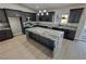 Modern kitchen featuring stainless steel appliances, dark cabinetry and an oversized central island at 1131 Lupin St, Pahrump, NV 89048