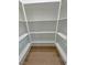This spacious walk-in pantry is equipped with ample white shelving at 1131 Lupin St, Pahrump, NV 89048