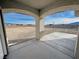 Covered front patio with stylish arched columns offering views of the surrounding desert landscape at 1131 Lupin St, Pahrump, NV 89048