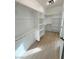 Spacious walk-in closet with wood floor, shelving, and clothing rods at 1131 Lupin St, Pahrump, NV 89048