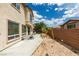 Shot of backyard featuring a patio, privacy wall, and low maintenance landscaping at 11769 Via Vera Cruz Ct, Las Vegas, NV 89138
