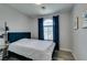 Inviting bedroom with comfortable bedding, stylish decor, and large window at 11769 Via Vera Cruz Ct, Las Vegas, NV 89138