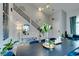 Elegant dining area featuring a modern staircase, sophisticated lighting, and stylish decor for memorable gatherings at 11769 Via Vera Cruz Ct, Las Vegas, NV 89138