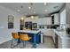 Well-equipped kitchen with a blue island, sleek appliances, and ample counter space for culinary creativity at 11769 Via Vera Cruz Ct, Las Vegas, NV 89138