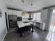 Stylish kitchen featuring a large island with seating, stainless steel appliances, and modern fixtures at 11769 Via Vera Cruz Ct, Las Vegas, NV 89138