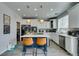 Functional kitchen with a blue island, plenty of storage, and modern appliances for effortless meal preparation at 11769 Via Vera Cruz Ct, Las Vegas, NV 89138