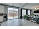 Open-concept living room with sliding glass door and view of the backyard at 11769 Via Vera Cruz Ct, Las Vegas, NV 89138
