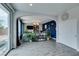 Open-concept living room with sliding glass door and view of the backyard at 11769 Via Vera Cruz Ct, Las Vegas, NV 89138