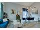 An open concept living room dining room area offers plenty of space for entertaining and relaxing at home at 11769 Via Vera Cruz Ct, Las Vegas, NV 89138