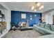 Spacious living room with modern decor and ample space for a home gym at 11769 Via Vera Cruz Ct, Las Vegas, NV 89138