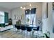 An open concept living room dining room area offers plenty of space for entertaining and relaxing at home at 11769 Via Vera Cruz Ct, Las Vegas, NV 89138