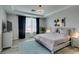 Cozy main bedroom featuring tray ceilings, plush bedding, and natural light at 11769 Via Vera Cruz Ct, Las Vegas, NV 89138