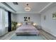 Relaxing main bedroom with tray ceilings, soft lighting, and neutral color palette at 11769 Via Vera Cruz Ct, Las Vegas, NV 89138