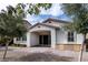 Charming single-story home featuring an arched entry, tiled roof, desert landscaping, and brick accents at 11843 Cogoleto Ave, Las Vegas, NV 89138