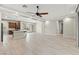 Expansive living area featuring an open floor plan, recessed lights, and a modern kitchen at 11843 Cogoleto Ave, Las Vegas, NV 89138