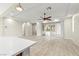 Bright and airy living room with tile floors, recessed lighting, and a ceiling fan at 11843 Cogoleto Ave, Las Vegas, NV 89138