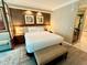 Comfortable bedroom with seating and a bathroom view at 125 E Harmon Ave # 1003, Las Vegas, NV 89109