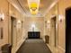 Elevator lobby with tiled walls and floors, plus modern lighting and furnishings at 125 E Harmon Ave # 1003, Las Vegas, NV 89109
