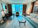 Cozy living area with city views, comfortable seating, and stylish decor, perfect for relaxation at 125 E Harmon Ave # 1003, Las Vegas, NV 89109