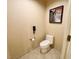 Cozy toilet room features a toilet and a mounted telephone at 125 E Harmon Ave # 1003, Las Vegas, NV 89109