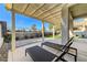 Well-designed backyard patio area with lounge chairs and a view of the lush landscaping at 1317 Fox Acres Dr, Las Vegas, NV 89134