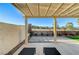 Inviting backyard patio featuring a pergola and view of the well-maintained yard with mountain views at 1317 Fox Acres Dr, Las Vegas, NV 89134