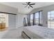 This primary bedroom features a sliding door to the primary bath and a door to the balcony at 1317 Fox Acres Dr, Las Vegas, NV 89134