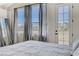 This bedroom has three windows with nice views, as well as a door to the balcony at 1317 Fox Acres Dr, Las Vegas, NV 89134