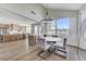 Bright dining area with modern chandelier, table for four, and open view of kitchen and mountain scenery at 1317 Fox Acres Dr, Las Vegas, NV 89134