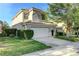 Beautiful two-story home featuring a tile roof, manicured lawn, and a two-car garage at 1317 Fox Acres Dr, Las Vegas, NV 89134