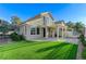 Charming exterior of the home with a well-maintained yard, stucco facade, and inviting backyard patio at 1317 Fox Acres Dr, Las Vegas, NV 89134