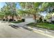Charming single-Gathering home with lush lawn, mature trees, and an attached two-car garage at 1317 Fox Acres Dr, Las Vegas, NV 89134