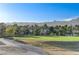 Scenic view of the lush golf course and majestic mountains, providing a peaceful backdrop for the property at 1317 Fox Acres Dr, Las Vegas, NV 89134