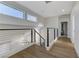 Bright second floor hallway featuring modern railing and access to bedrooms at 1317 Fox Acres Dr, Las Vegas, NV 89134