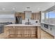 Stylish kitchen featuring an island with seating, stainless steel appliances, and bright countertops, ideal for cooking at 1317 Fox Acres Dr, Las Vegas, NV 89134