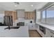 Bright kitchen with modern cabinetry, sleek countertops, stainless steel appliances, and a stylish tile backsplash at 1317 Fox Acres Dr, Las Vegas, NV 89134