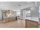Well-lit kitchen with an island, stainless steel appliances, and a view of the backyard, perfect for modern living at 1317 Fox Acres Dr, Las Vegas, NV 89134