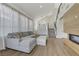 Modern living area with fireplace, staircase, and an abundance of natural light at 1317 Fox Acres Dr, Las Vegas, NV 89134