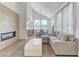 Bright open floor plan with wood-style floors, fireplace feature, and natural light at 1317 Fox Acres Dr, Las Vegas, NV 89134