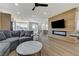 Comfortable living area featuring a wood accent wall with a fireplace at 1317 Fox Acres Dr, Las Vegas, NV 89134