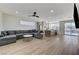 Open-concept living space combining living area and kitchen with outdoor access at 1317 Fox Acres Dr, Las Vegas, NV 89134