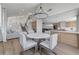 Spacious open-concept living area with modern decor, including a dining area, kitchen, and staircase at 1317 Fox Acres Dr, Las Vegas, NV 89134