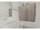 Clean bathroom featuring a white vanity, toilet, and bathtub with shower curtain at 1329 Jewelstone Cir, Henderson, NV 89012