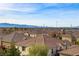 Panoramic aerial view showcasing the community's prime location with a stunning skyline and mountain backdrop in the distance at 1329 Jewelstone Cir, Henderson, NV 89012