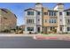 Charming multi-story townhome featuring a stucco facade, tiled roof, and well-maintained landscaping at 1329 Jewelstone Cir, Henderson, NV 89012