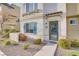 Inviting front entrance with a walkway, decorative rock landscaping, and mature shrubs at 1329 Jewelstone Cir, Henderson, NV 89012
