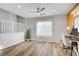 Well-lit loft space with wood floors, a desk, and a view from the window at 1329 Jewelstone Cir, Henderson, NV 89012